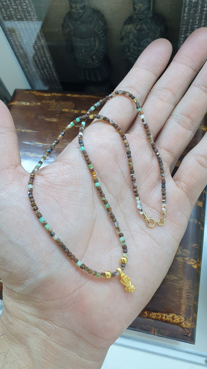 Close up of 24K Gold Mini Pixiu Charm on Gemstone Beaded Chain